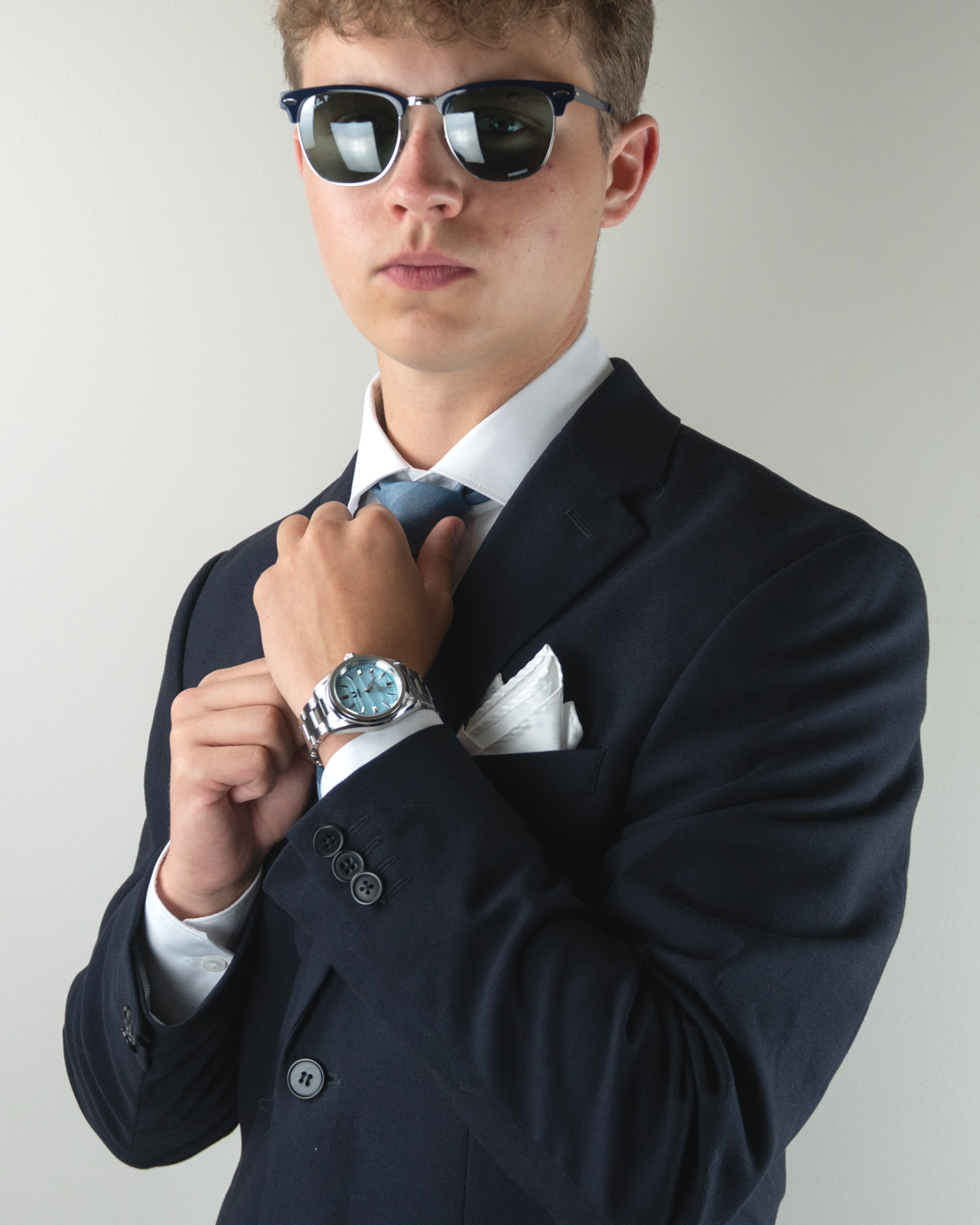 Azure automatic watch worn with a navy suit