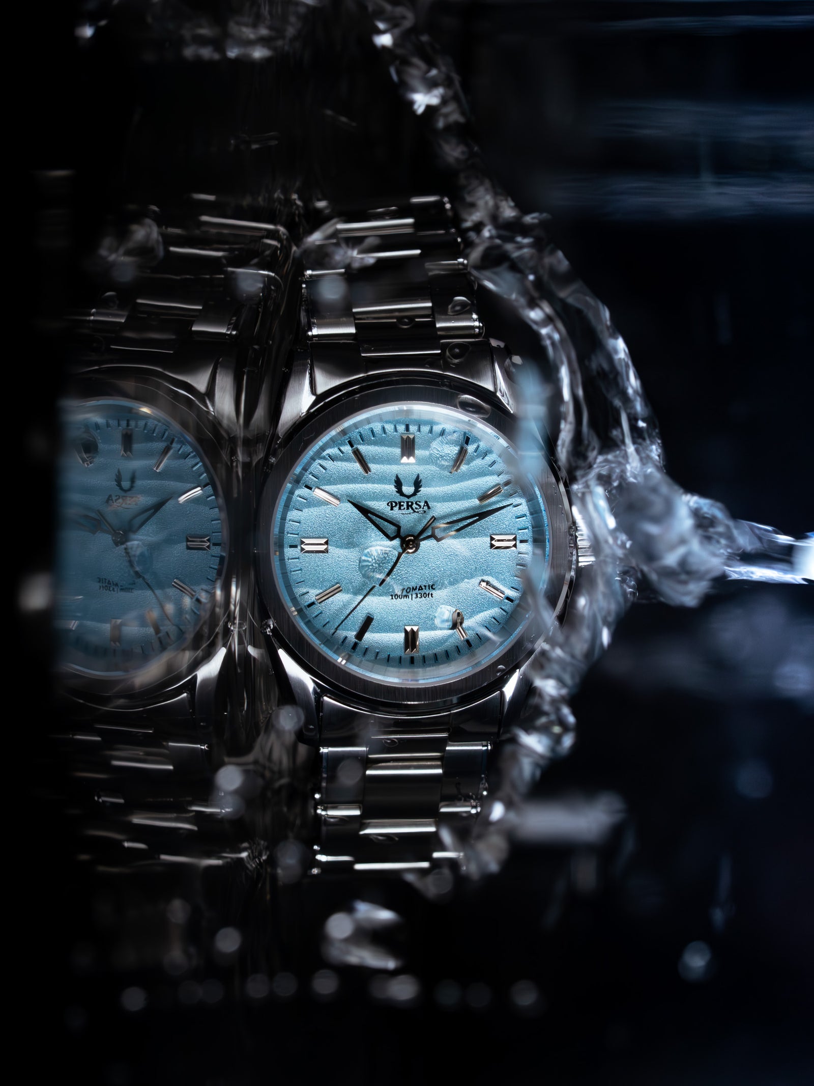Azure automatic watch with blue textured dial and water splash detail